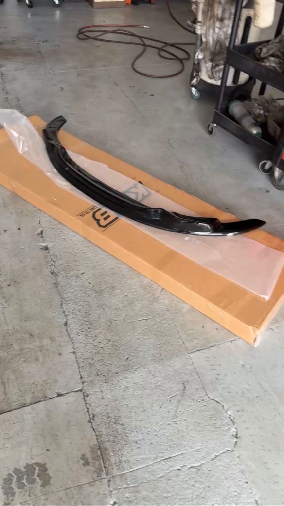 Gloss black front lip / splitter ready to be fitted at Ignite Autos