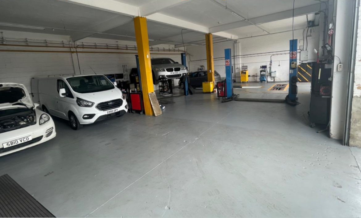 Ignite Autos workshop — multiple bays with vehicle lifts